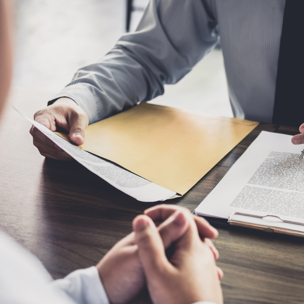 Photo of two people having a meeting at a desk